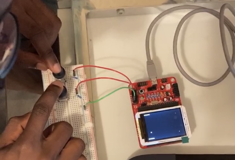 Microcontroller with two-player Pong game running connected to two push buttons